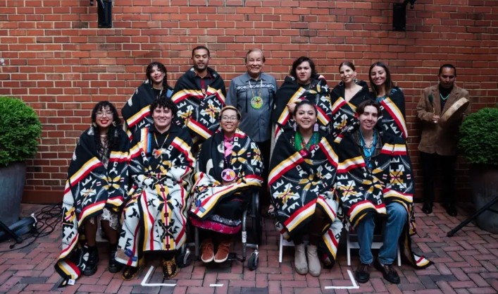 Group of 2024 Dreamstarter participants wearing traditional Native blankets