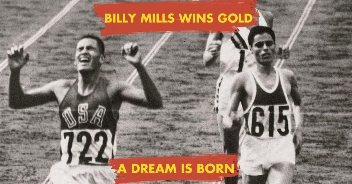 Billy Mills (USA 722) crosses the finish line with arms raised, winning the 10,000m gold medal at the 1964 Tokyo Olympics.
