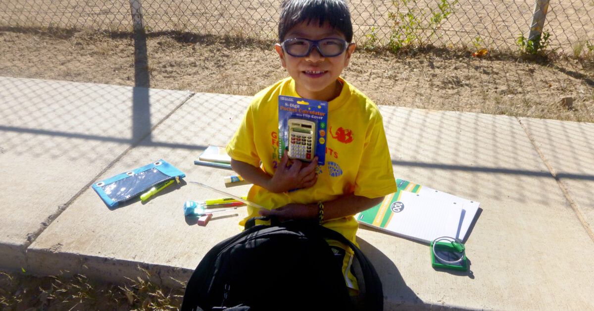 FY15_371_Global_15_15_Kykotsmovi Hopi Third Mesa boy with calculator